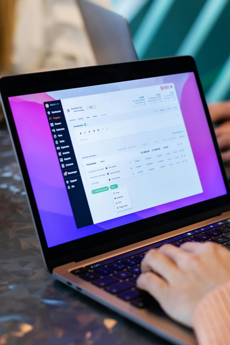 Laptop screen showing remote monitoring dashboard — Helport.ai real-time performance tracking for support teams